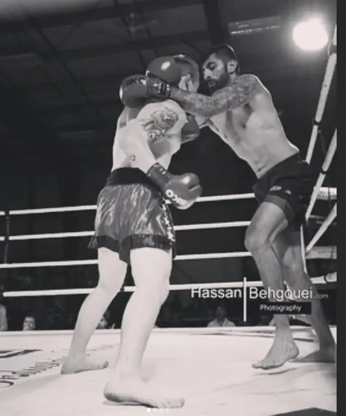 Perry Hayer working the clinch against the ropes during a bout